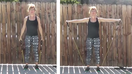 Fitness instructor demonstrating Lateral raise exercise with resistance band